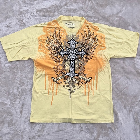 Urban Outfitters Tops - Yellow Cross Graphic Tee